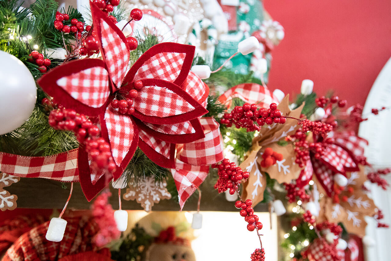 Check plaid and red berry picks for garland